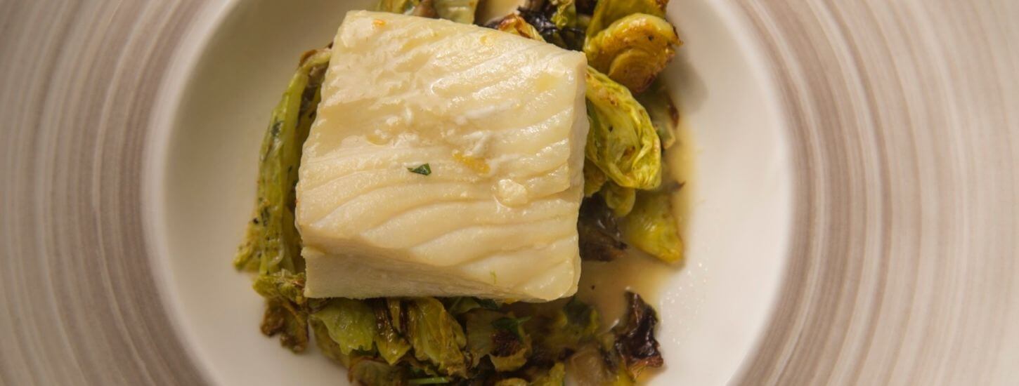 Striped Bass Braised in Mussel Liquor with Brussel Sprouts, Cabbage and Fresno Chili