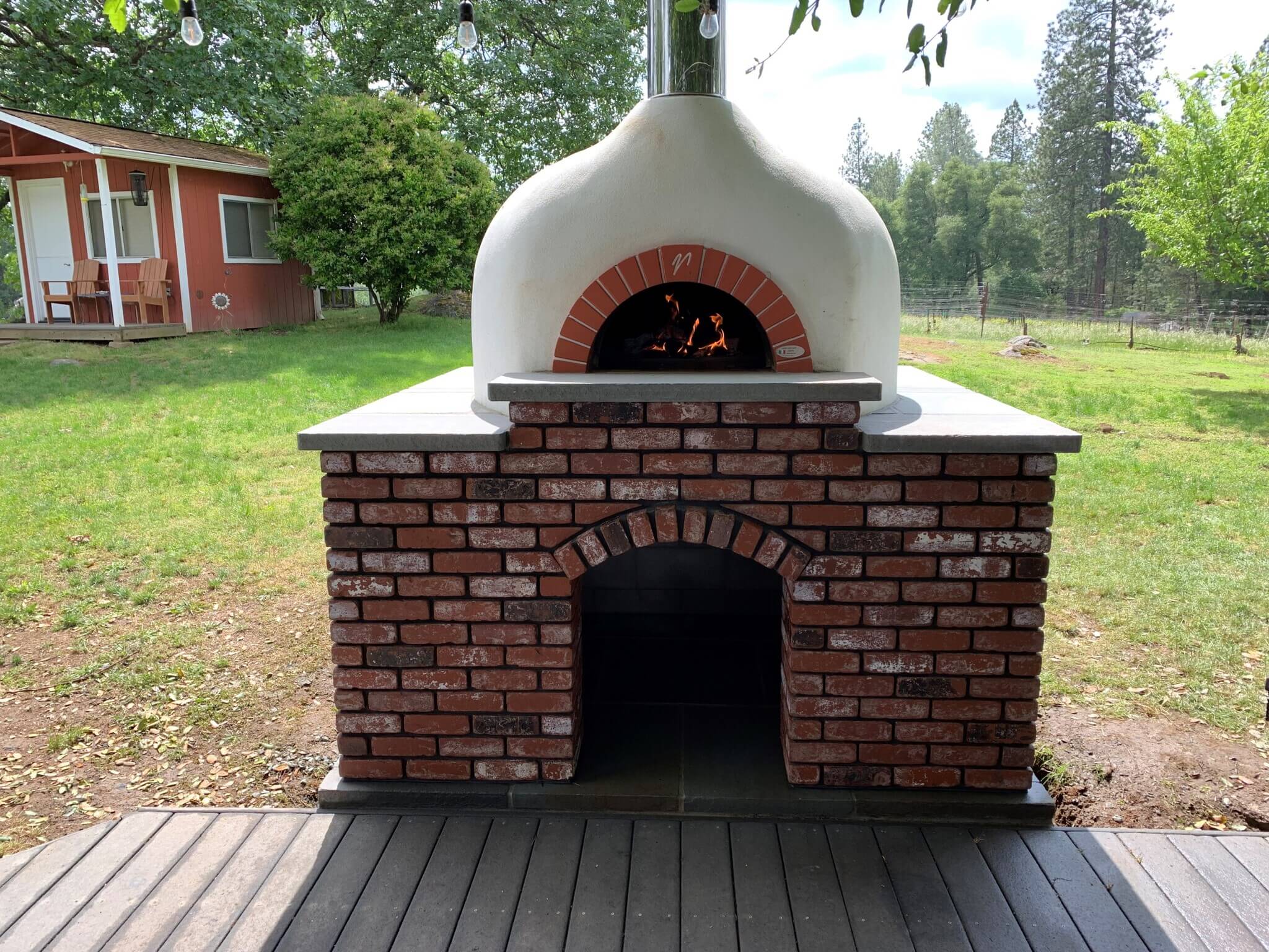 Mugnaini wood fired oven in an outdoor setting